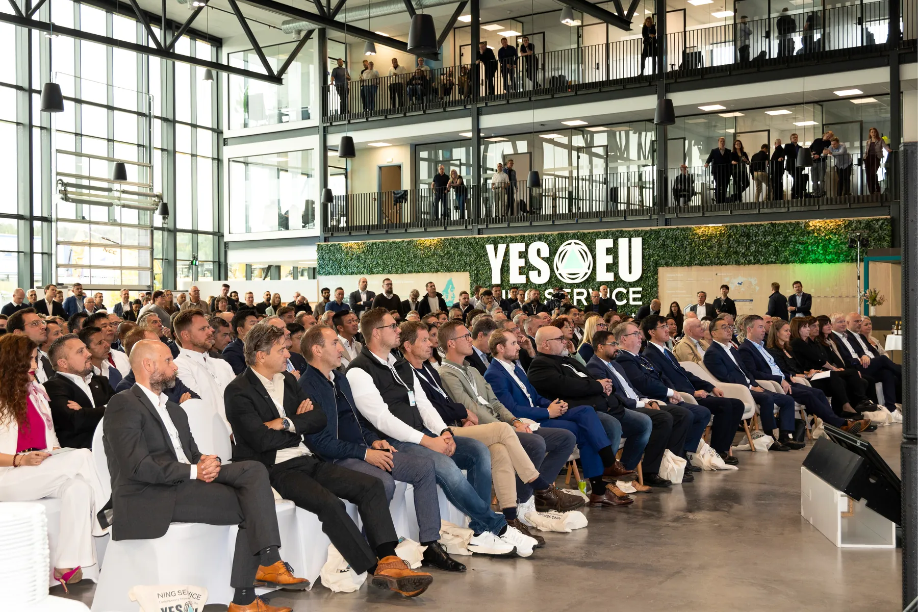 Audience seated inside the YES-EU NING Service Center during the opening event
